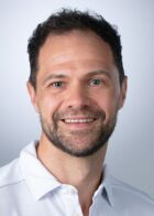 Portrait von Dr. med. Patrick Brust.